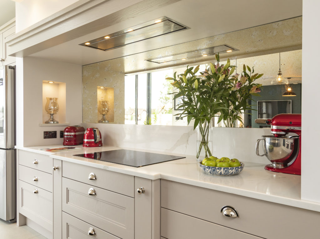 Solid brass handles in a polished nickel finish bring warmth and richness to this Classic kitchen